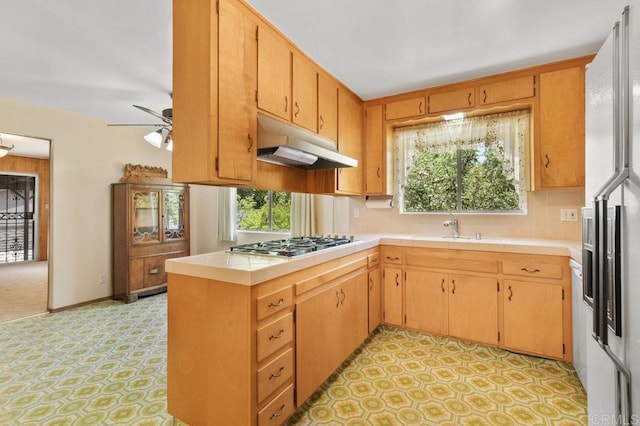 3448 Goldfinch St, San Diego, CA 92103 - kitchen with under cabinet range hood, stainless steel gas stovetop, light flooring, tasteful backsplash, and a ceiling fan