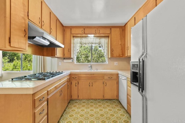 3448 Goldfinch St, San Diego, CA 92103 - kitchen with white appliances, under cabinet range hood, backsplash, and plenty of natural light
