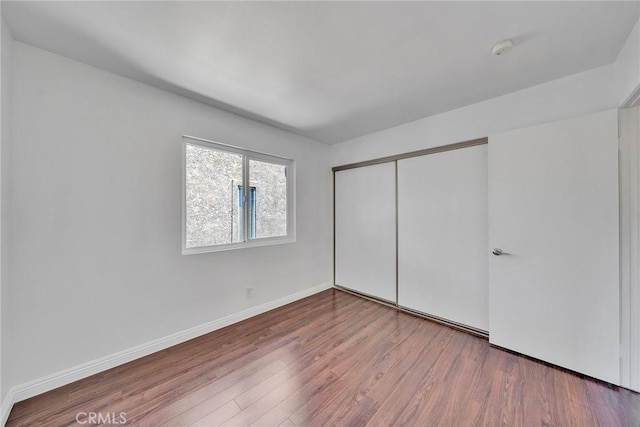 14711 Moon Crest Ln Unit B, Chino Hills, CA 91709 - unfurnished bedroom featuring wood finished floors and a closet
