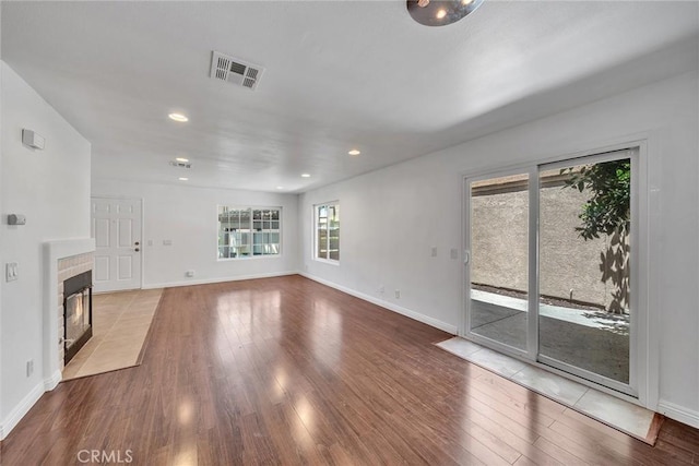 14711 Moon Crest Ln Unit B, Chino Hills, CA 91709 - unfurnished living room with wood finished floors, a brick fireplace, and recessed lighting