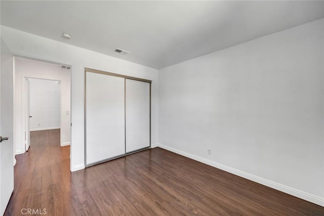 14711 Moon Crest Ln Unit B, Chino Hills, CA 91709 - unfurnished bedroom with dark wood-style flooring and a closet