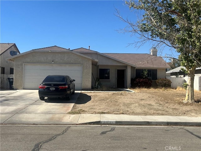 2021 Buckwheat Ave, Rosamond, CA 93560 - single story home featuring concrete driveway, stucco siding, an attached garage, and a chimney