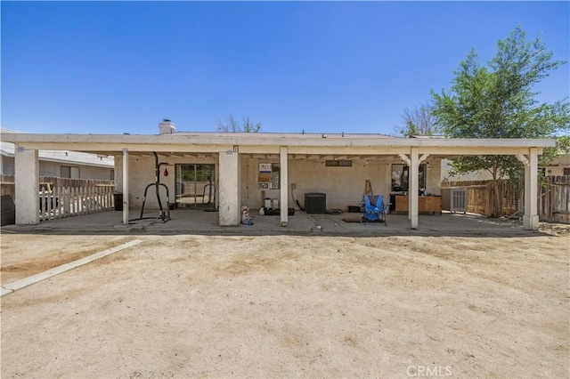 2021 Buckwheat Ave, Rosamond, CA 93560 - back of property with a patio area and stucco siding