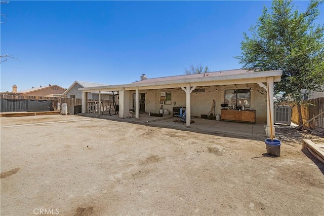 2021 Buckwheat Ave, Rosamond, CA 93560 - back of property featuring stucco siding and a patio