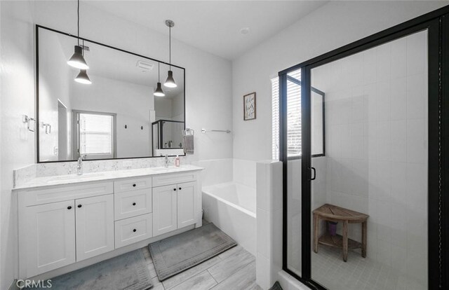 825 Spring St W, Madera, CA 93636 - full bath featuring a shower stall, a bath, and double vanity