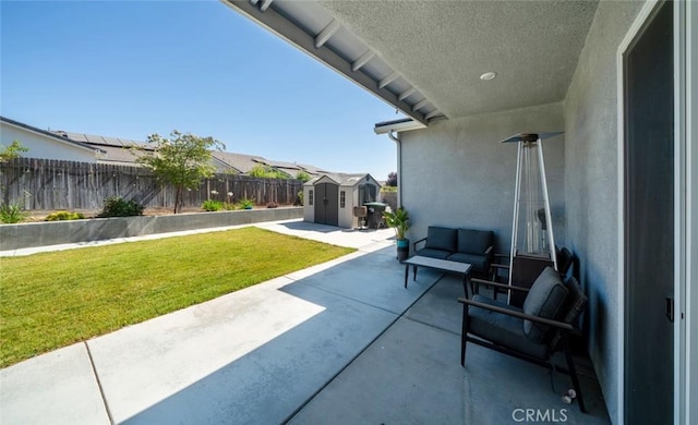 825 Spring St W, Madera, CA 93636 - fenced backyard featuring a storage unit, a patio area, and a residential view