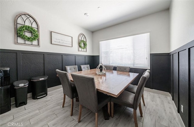 825 Spring St W, Madera, CA 93636 - dining room featuring wainscoting and light wood finished floors