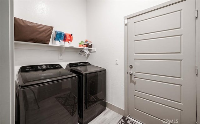 825 Spring St W, Madera, CA 93636 - laundry area featuring separate washer and dryer and light wood finished floors
