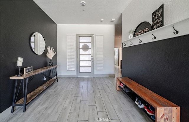 825 Spring St W, Madera, CA 93636 - mudroom with wood finished floors and a textured wall