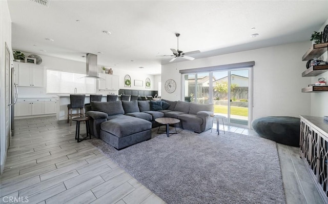 825 Spring St W, Madera, CA 93636 - living area with ceiling fan and light wood finished floors