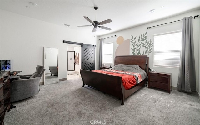 825 Spring St W, Madera, CA 93636 - carpeted bedroom featuring a barn door and ceiling fan