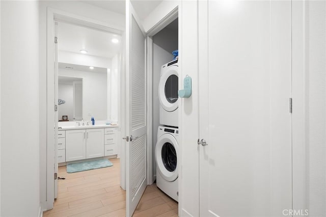 3100 Rivington, Irvine, CA 92612 - laundry room featuring stacked washing machine and dryer, light wood-style flooring, and recessed lighting
