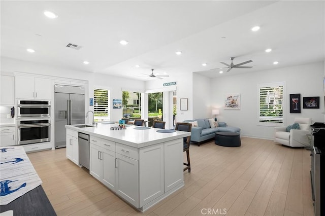 3100 Rivington, Irvine, CA 92612 - kitchen featuring open floor plan, stainless steel appliances, a ceiling fan, and recessed lighting