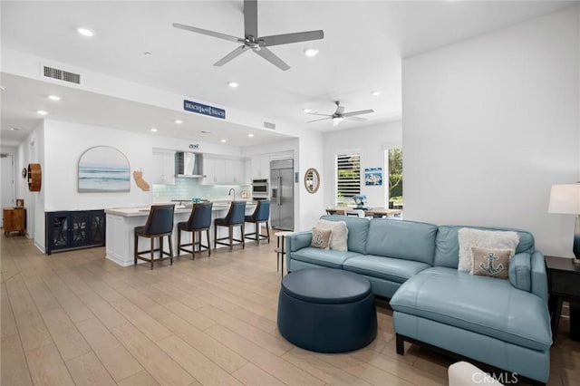 3100 Rivington, Irvine, CA 92612 - living area with a ceiling fan, light wood-style floors, and recessed lighting