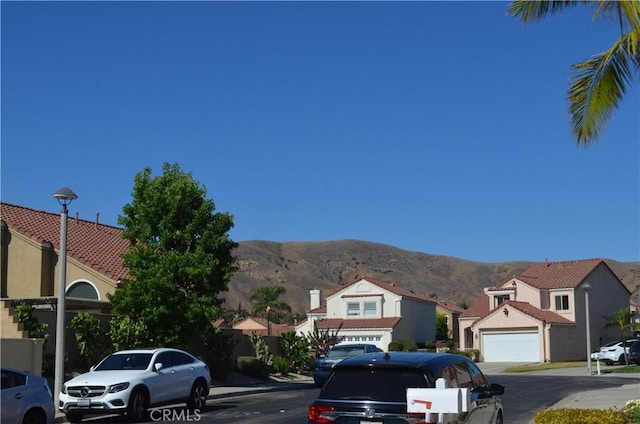 25592 Aragon Way, Yorba Linda, CA 92887 - view of asphalt road with a mountain view, street lighting, and a residential view