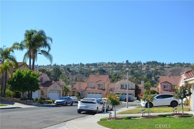25592 Aragon Way, Yorba Linda, CA 92887 - view of asphalt road with a residential view, sidewalks, street lights, and curbs