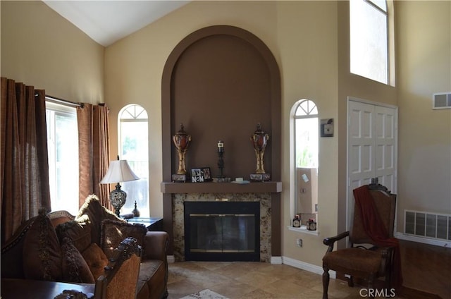 25592 Aragon Way, Yorba Linda, CA 92887 - living room featuring high vaulted ceiling, plenty of natural light, a glass covered fireplace, and arched walkways