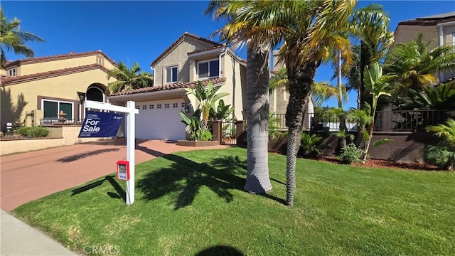 25592 Aragon Way, Yorba Linda, CA 92887 - mediterranean / spanish-style home featuring a garage, driveway, stucco siding, and a front yard