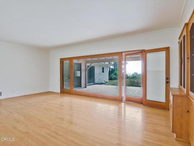 3914 Alta Vista Dr, La Canada Flintridge, CA 91011 - empty room with light wood-type flooring, french doors, and crown molding