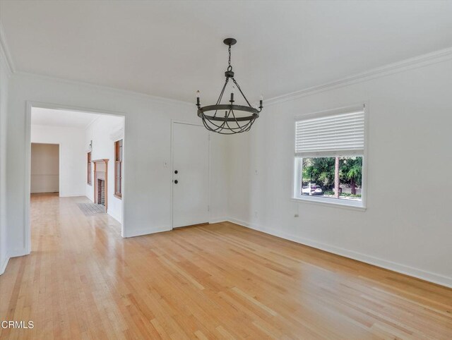 3914 Alta Vista Dr, La Canada Flintridge, CA 91011 - unfurnished room featuring ornamental molding, light wood finished floors, and a chandelier