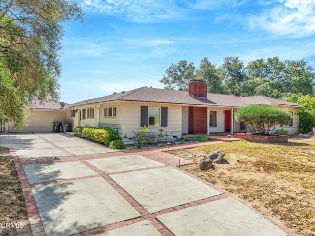 3914 Alta Vista Dr, La Canada Flintridge, CA 91011 - single story home with concrete driveway and a chimney