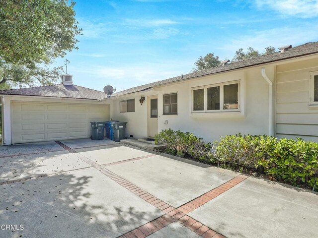 3914 Alta Vista Dr, La Canada Flintridge, CA 91011 - view of front of property featuring driveway, stucco siding, and a garage