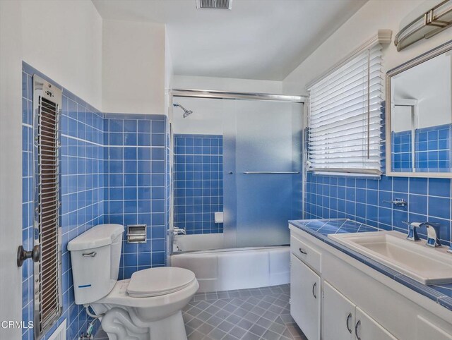3914 Alta Vista Dr, La Canada Flintridge, CA 91011 - full bathroom with tile walls, vanity, combined bath / shower with glass door, and tile patterned flooring