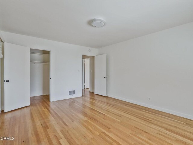 3914 Alta Vista Dr, La Canada Flintridge, CA 91011 - unfurnished bedroom with light wood finished floors and a closet