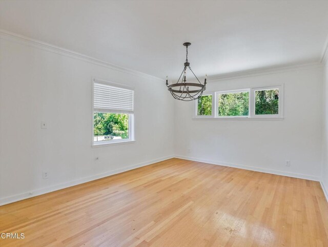 3914 Alta Vista Dr, La Canada Flintridge, CA 91011 - unfurnished room featuring a chandelier, ornamental molding, plenty of natural light, and wood finished floors