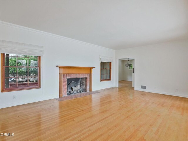 3914 Alta Vista Dr, La Canada Flintridge, CA 91011 - unfurnished living room with wood finished floors, a fireplace, a chandelier, and ornamental molding