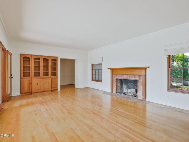 3914 Alta Vista Dr, La Canada Flintridge, CA 91011 - unfurnished living room with light wood finished floors, a fireplace, and ornamental molding