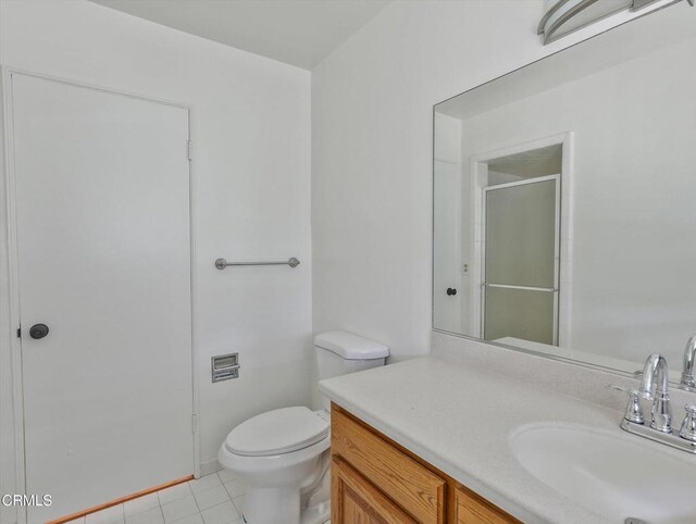 3914 Alta Vista Dr, La Canada Flintridge, CA 91011 - bathroom featuring vanity, tile patterned flooring, and a shower with door