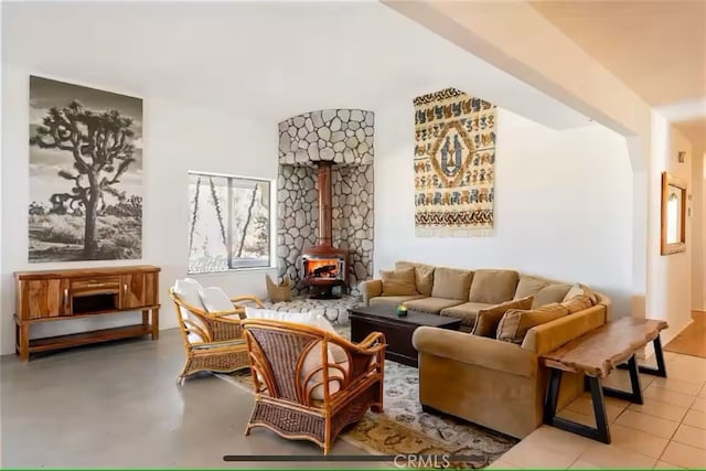 70138 Sullivan Rd Unit 29, Palms, CA 92277 - living area featuring a wood stove and finished concrete flooring