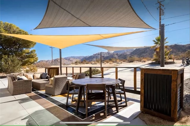 70138 Sullivan Rd Unit 29, Palms, CA 92277 - view of patio with a mountain view, outdoor lounge area, and outdoor dining area