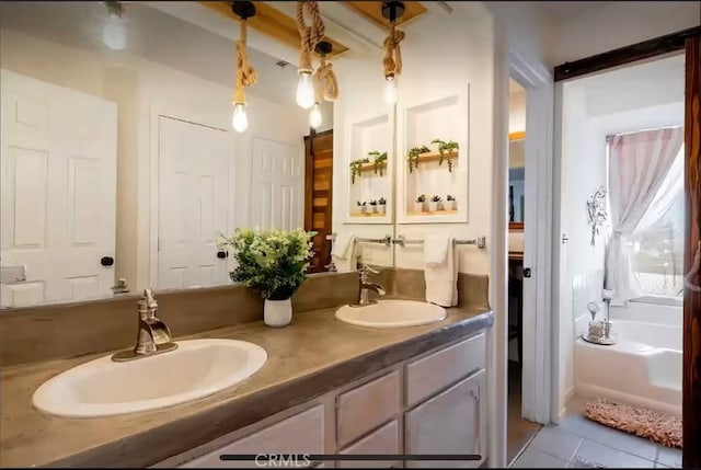 70138 Sullivan Rd Unit 29, Palms, CA 92277 - full bath featuring double vanity, tile patterned floors, and a bathtub