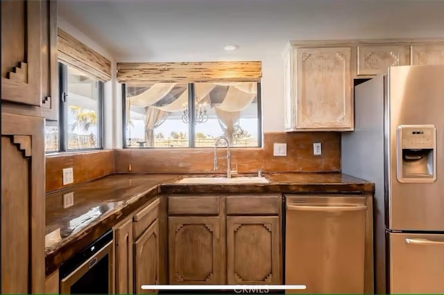 70138 Sullivan Rd Unit 29, Palms, CA 92277 - kitchen featuring stainless steel appliances, wine cooler, plenty of natural light, and dark countertops