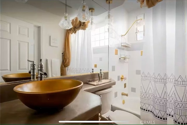 70138 Sullivan Rd Unit 29, Palms, CA 92277 - bathroom featuring shower / bathtub combination with curtain and vanity