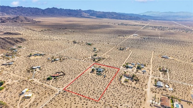 70138 Sullivan Rd Unit 29, Palms, CA 92277 - overview of rural landscape featuring a mountainous background and property boundaries highlighted