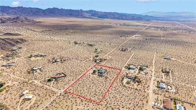70138 Sullivan Rd Unit 29, Palms, CA 92277 - aerial view of sparsely populated area featuring a mountainous background and property boundaries highlighted