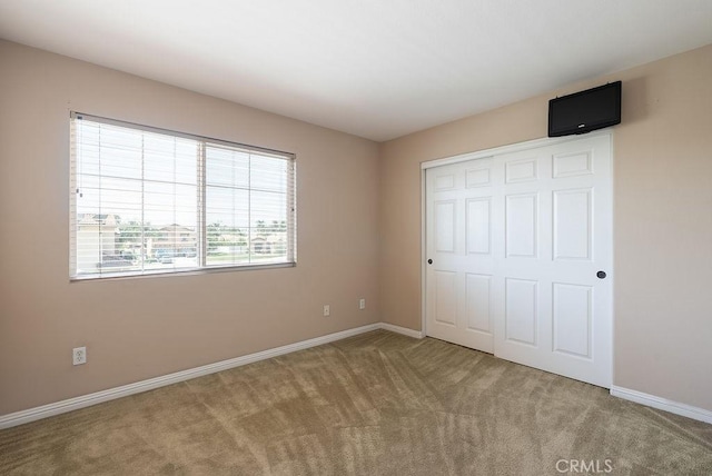 117 S Machala Pl, Rialto, CA 92376 - unfurnished bedroom with carpet and a closet