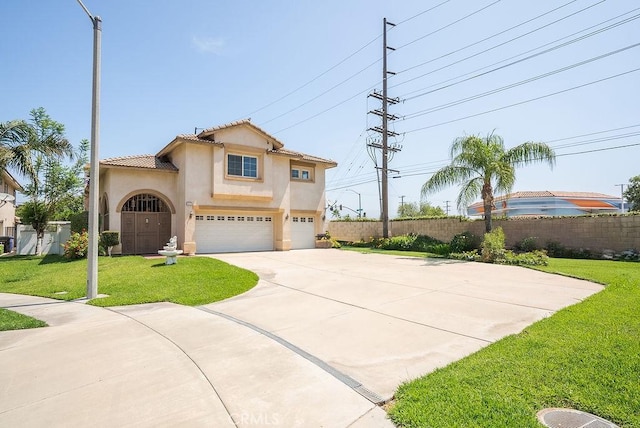 117 S Machala Pl, Rialto, CA 92376 - mediterranean / spanish-style home with stucco siding, a garage, driveway, and a tiled roof