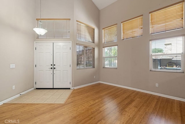 117 S Machala Pl, Rialto, CA 92376 - entryway with a high ceiling, light wood finished floors, and plenty of natural light