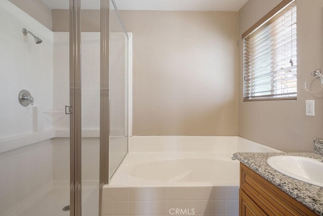 117 S Machala Pl, Rialto, CA 92376 - bathroom featuring a shower stall, a garden tub, and vanity