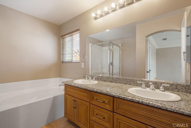 117 S Machala Pl, Rialto, CA 92376 - bathroom with a shower stall, a bath, double vanity, tile patterned flooring, and ornamental molding