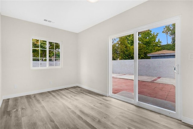339 E 8th St, Azusa, CA 91702 - empty room with plenty of natural light and wood finished floors