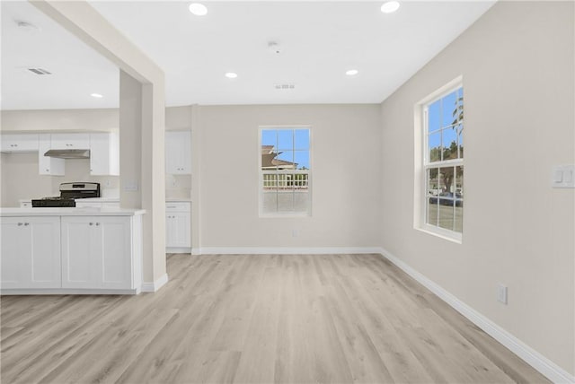 339 E 8th St, Azusa, CA 91702 - unfurnished living room with light wood-style flooring, healthy amount of natural light, and recessed lighting