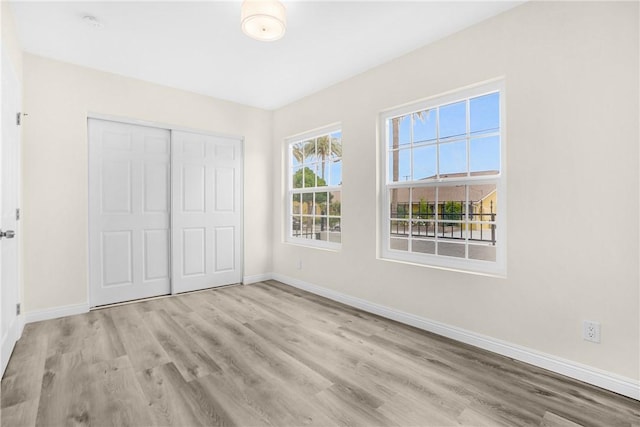 339 E 8th St, Azusa, CA 91702 - unfurnished bedroom featuring wood finished floors and a closet