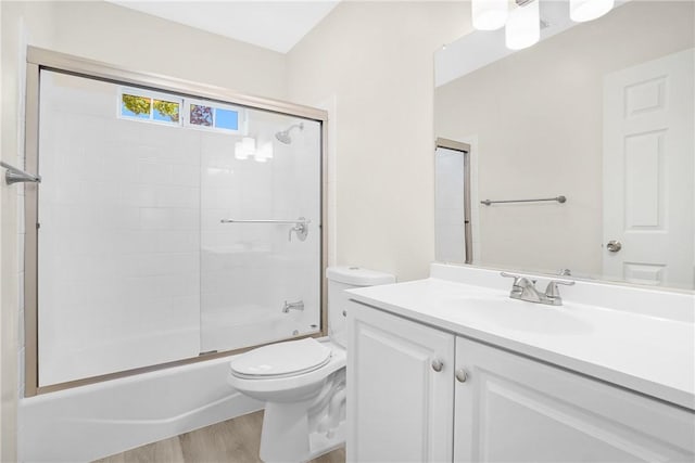 339 E 8th St, Azusa, CA 91702 - full bathroom with vanity, wood finished floors, and bath / shower combo with glass door