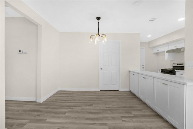 339 E 8th St, Azusa, CA 91702 - unfurnished dining area with a chandelier, light wood-style floors, and recessed lighting