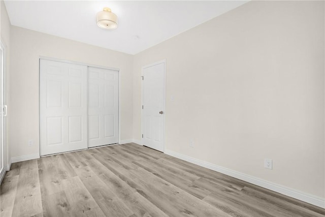 339 E 8th St, Azusa, CA 91702 - unfurnished bedroom featuring wood finished floors and a closet